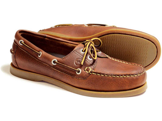 The CREEK Ladies Orca Bay Deck Shoe in Havana Brown features brown leather with white stitching, tan laces through metal eyelets, and a light brown slip-resistant rubber sole. They offer a casual yet classic design akin to the Orca Bay Creek Havana Deck Shoes.