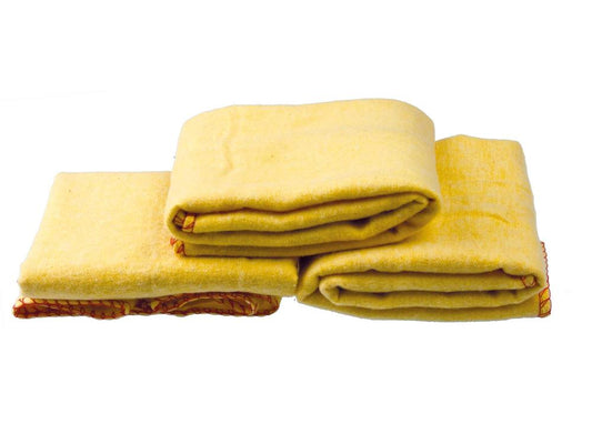 Three folded yellow Cathcart Elliot extra-large blankets, with simple textures and orange trims reminiscent of a polishing duster, are stacked against a plain white background, showcasing their high-quality design.