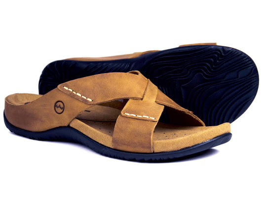 The Orca Bay ARUBA Mens Sandal boasts a stylish sand leather upper with visible stitching and a subtle cross-strap logo. Crafted from oiled leather, it features black textured soles for grip and a cushioned midsole for comfort.