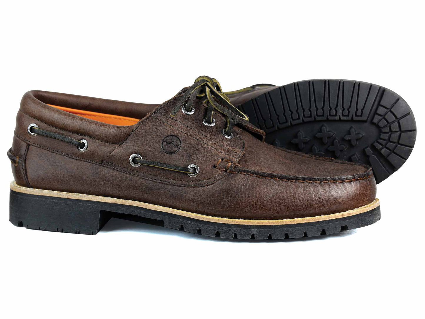 Orca Bays Buffalo Mens Dark Brown Deck Shoe features dark green laces, thick black rubber soles, metal eyelets, and stitching details. One shoe stands upright while the other lies on its side, showcasing the tread pattern.