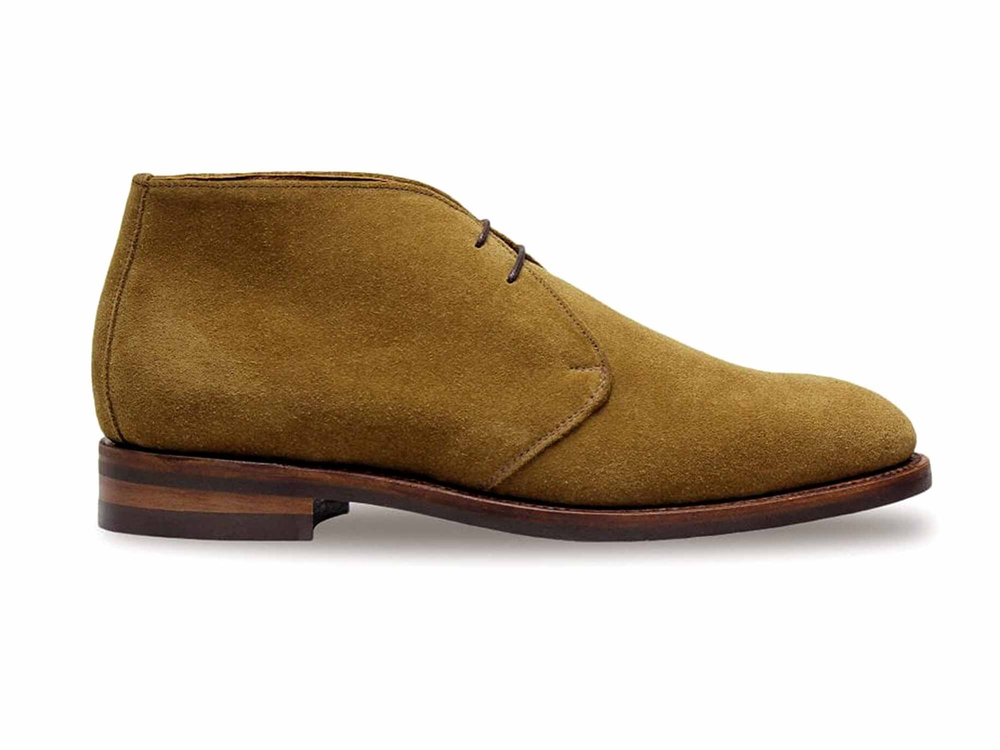 The CHESHAM Indiana Tan Suede Chukka Boot by Sanders features a Goodyear welted rubber sole, two eyelets, and dark brown laces. It boasts a smooth, rounded toe with subtle heel detailing and is shown in a side view.