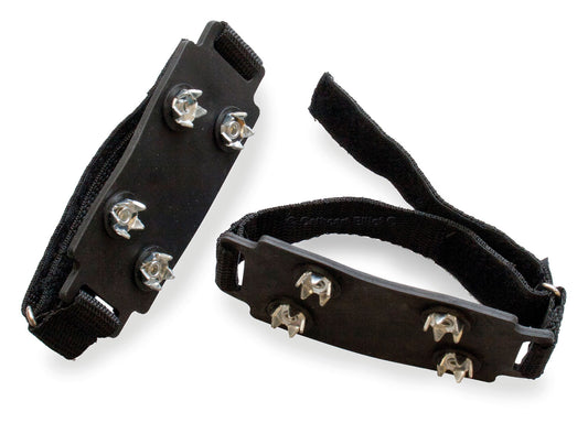 Two Pocket ice grips from Cathcart Elliot, featuring black traction devices with metal spikes on a rectangular rubber base and adjustable straps, ideal for securely gripping icy surfaces in snow conditions.