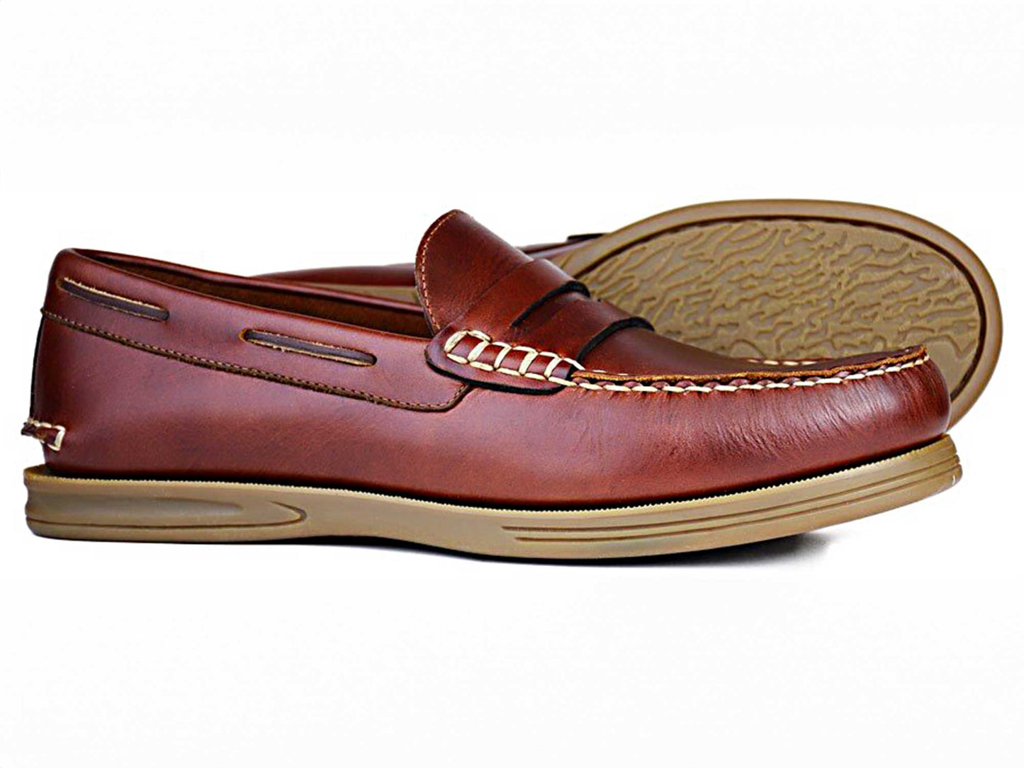 Orca Bays KIP Mens Wide Deck Shoes in Saddle Brown boast a hand-stitched design with a decorative bit on the upper, featuring wide-fit leather moccasins and light tan non-slip rubber soles for safe, stylish wear.