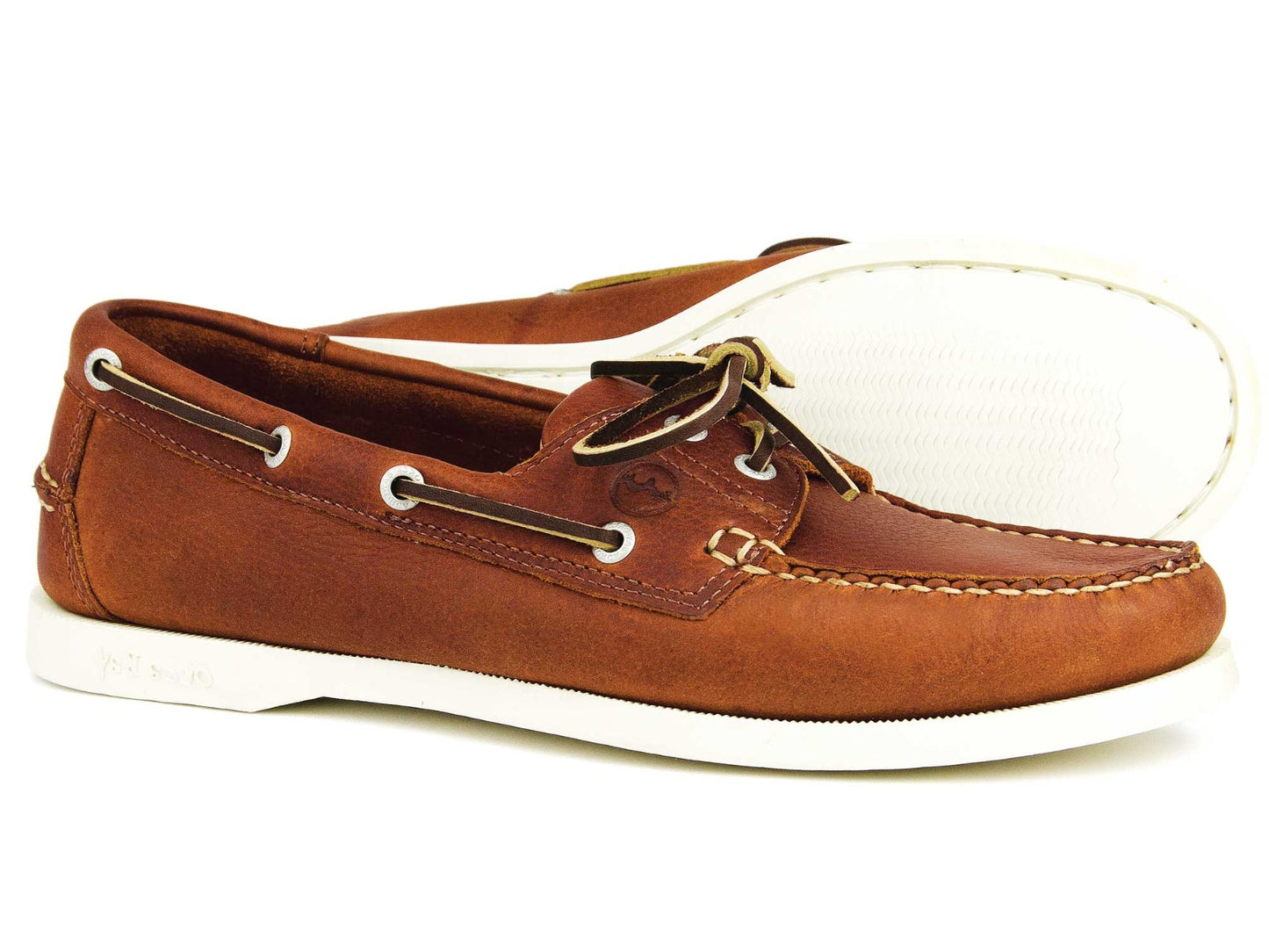 The MAINE Ladies Havana Leather Deck Shoe by Orca Bay features brown leather with white soles, moccasin construction, white stitching, brown laces, and beige lining. One shoe stands upright while the other is angled to show the sole.