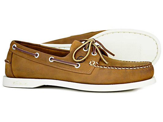 The MAINE Mens Orca Bay Deck Shoe in Sand Nubuck by Orca Bay features brown leather, white rubber soles, and classic white stitching. The moccasins have a lace-up design with leather laces threaded through metal eyelets, one shoe positioned gracefully in front of the other.