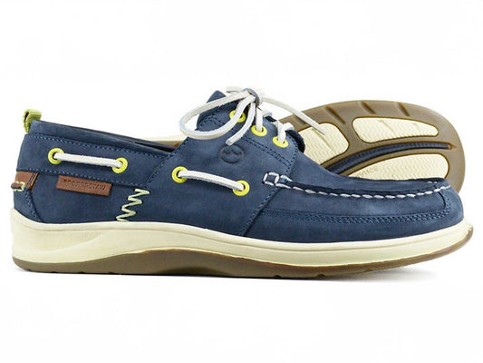 The OCEAN Mens Navy Blue Waterproof Deck Shoe by Orca Bay features white laces, yellow eyelets, a siped rubber sole, brown accents, and a moccasin-style stitched toe. Orca Bay is embossed on a leather patch for added style and functionality.