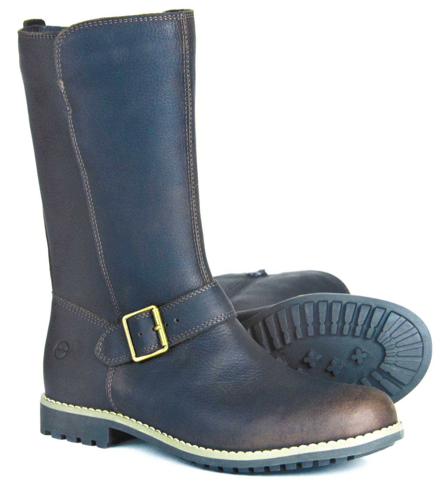 The SALE STOW Ladies Leather Dark Brown Boots by Orca Bay feature mid-calf height and a decorative gold buckle. These water-resistant boots have a rugged sole with visible tread patterns, ideal for all terrains; one boot stands upright to display the durable sole, and the other is slightly tilted.