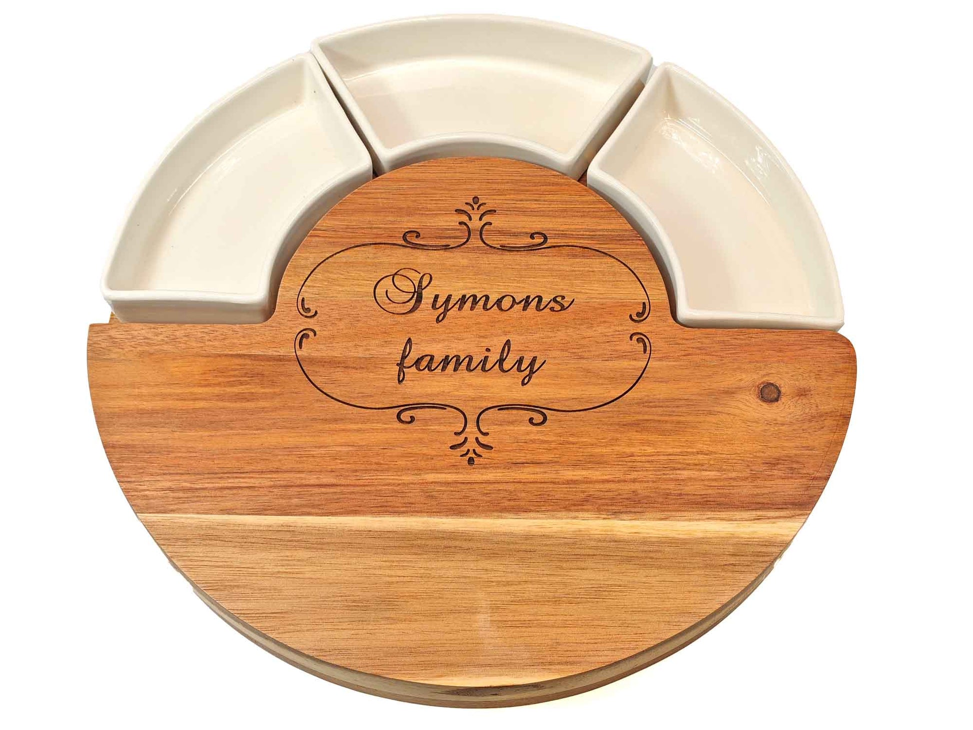 The Cathcart Elliot Personalised 30cm Round Acacia Cheeseboard and Meat Platter with Dishes is a beautifully crafted acacia wood platter that elegantly displays white bowls, ideal for personalized cheese presentations.